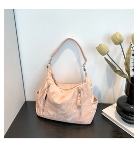 Detail of pink marble hobo bag showing zipper pockets and waterproof texture