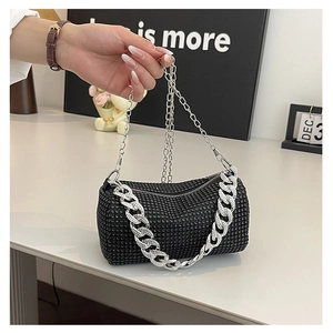 Detail showing shiny black rhinestones and chunky silver chain on a Boston bag