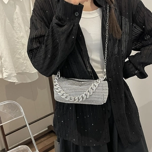 Chic silver rhinestone cylinder handbag with chunky metal chain and crossbody strap