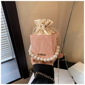 Pink marble pattern PU leather handbag with pearl handle and golden chain strap
