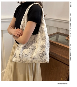 Detail of woven jacquard butterfly tote bag with raw edges and spacious interior