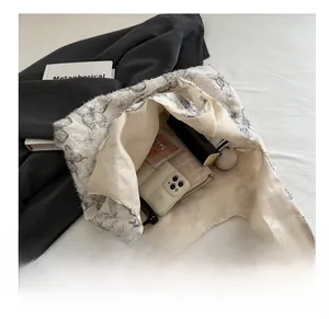 Interior view showing large capacity for essentials in butterfly jacquard tote bag