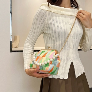 Chic color-block shell bag with pearl handle and gold chain strap for women