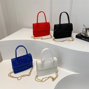 Mini lychee texture crossbody bags with gold chains in red, black, blue, and white colors