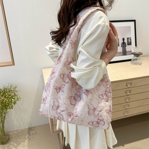 Pink jacquard tote bag with butterfly pattern and embossed texture for women