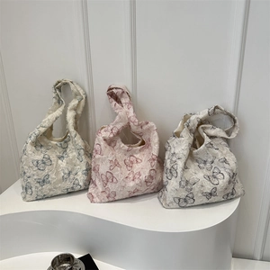 Floral butterfly jacquard tote bags in blue, pink and black with fringe texture
