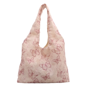 Minimalist jacquard tote bag with pink butterfly patterns and textured lace fabric
