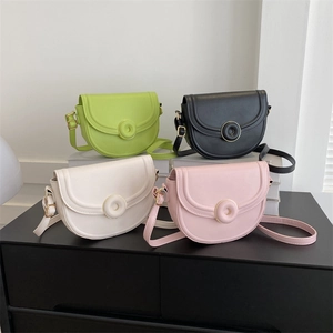 Minimalist leather saddle shoulder bag for women in four pastel colors on display