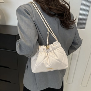 White quilted cloud shoulder bag with gold chain strap and elegant rhombus pattern