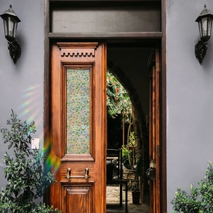Rainbow refraction effect on door window with colorful floral static glass film