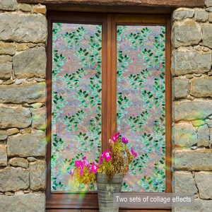 Floral mosaic window film with green leaves and pink flowers on stone wall background