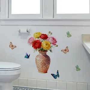 Detail of floral wall stickers with watercolor vase and butterflies on a white tile wall