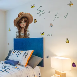 Detail of cute girl wall sticker with butterflies and motivational quotes for bedroom