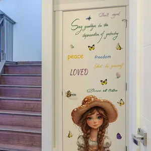 Detailed view of cute angel girl wall sticker with butterfly and motivational text on white door