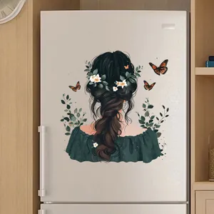 Close-up of cute cartoon girl and butterfly stickers on a silver refrigerator