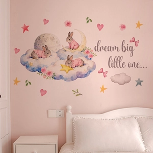Détail de stickers muraux lapins à l'aquarelle avec étoiles et lune pour chambre d'enfant