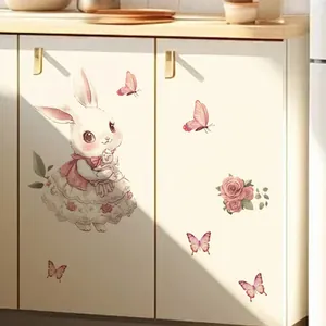 Detail of cute bunny and pink floral wall decals applied on a kitchen cabinet door