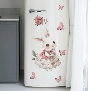 Close-up of a cute white rabbit sticker with roses and butterflies on a white fridge