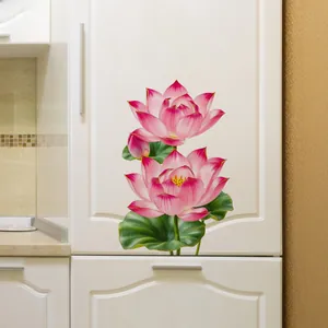 Detail of self-adhesive pink lotus flower wall stickers on white kitchen cabinet surfaces