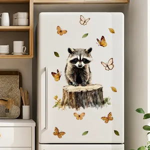 Detail of self-adhesive raccoon wall sticker with butterflies on a white refrigerator surface