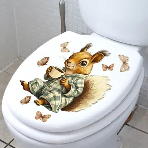 Detail of self-adhesive toilet lid decal featuring a cute cartoon squirrel drinking coffee