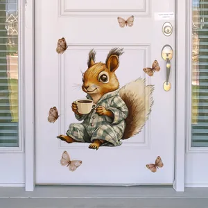Detail of cute squirrel in pajamas and butterfly wall stickers on a white door