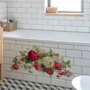 Detail of floral wall stickers with roses and leaves applied to a bathtub side panel