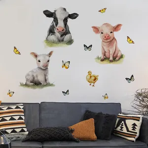 Detailed farm animal wall stickers featuring watercolor cows and pigs over a blue sofa
