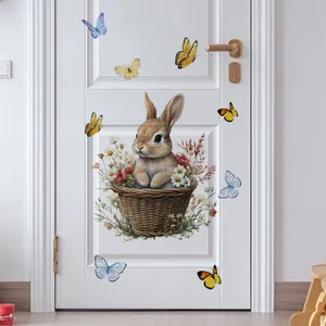 Detailed view of self-adhesive wall sticker featuring a bunny in a basket on a white door
