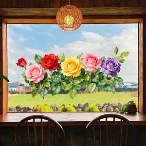 Vue détaillée du film de fenêtre jardin de roses colorées sur verre avec paysage