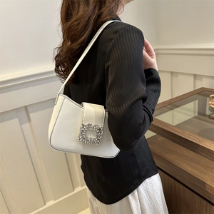 Chic white underarm bag with crystal buckle and smooth leather texture for women