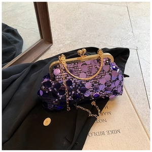 Detail of purple sequin evening clutch bag with gold kiss-lock frame and chain strap