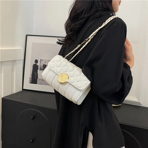 White quilted leather mini crossbody bag with gold chain strap and turn-lock closure