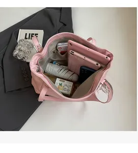 Pink tote bag interior showing large capacity for tablet, umbrella, and daily essentials