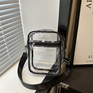 Transparent PVC crossbody bag with black trim and adjustable nylon shoulder strap