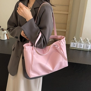 Minimalist large capacity pink tote bag for women shown in a modern lifestyle setting