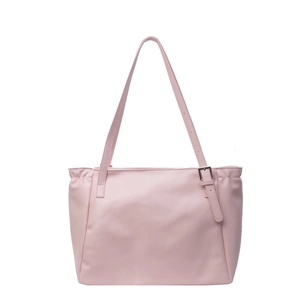 Minimalist light pink tote bag with adjustable shoulder straps and pleated sides for women