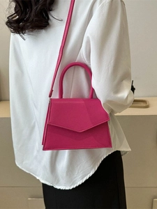 Chic rose pink leather handbag for women featuring a V-shaped flap and versatile crossbody strap