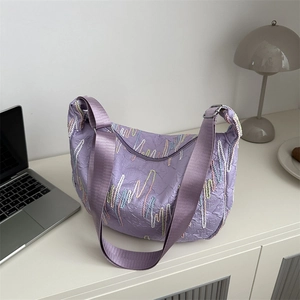 Lavender purple dumpling crescent bag with wave embroidery and adjustable strap