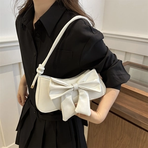 Chic cream bow shoulder bag for women with knotted rope strap for summer fashion style