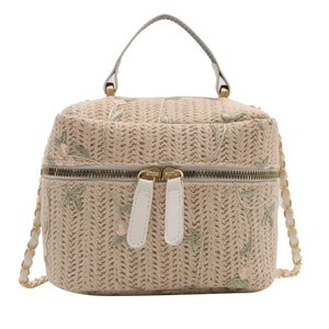 Minimalist straw bucket bag with floral embroidery and gold chain strap for women