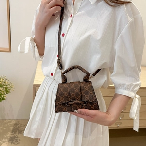 Classic dark brown mini crossbody bag with geometric pattern and vintage metal buckle