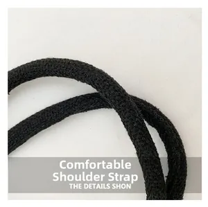 Detailed macro view of the comfortable black woven shoulder strap texture for tote bags