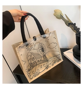 Detail view of rustic jute tote bag with transparent PVC panel and farmhouse illustration