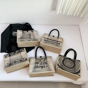 Large transparent canvas tote bags with five printed designs and black round handles