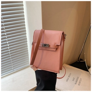 Detail of pink Saffiano leather mini bag with silver metal swivel lock and strap