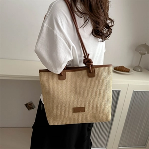 Large woven beach tote bag with V-pattern texture and brown faux leather knotted handles