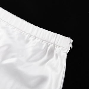 Detail of white satin skirt waist with elastic band and hidden side zipper closure