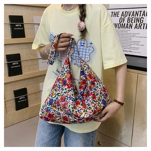 Detail of floral canvas tote bag showing the vintage red rose pattern and large capacity