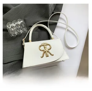 Detailed view of the small white leather crossbody bag with a gold RR logo buckle and phone size ref